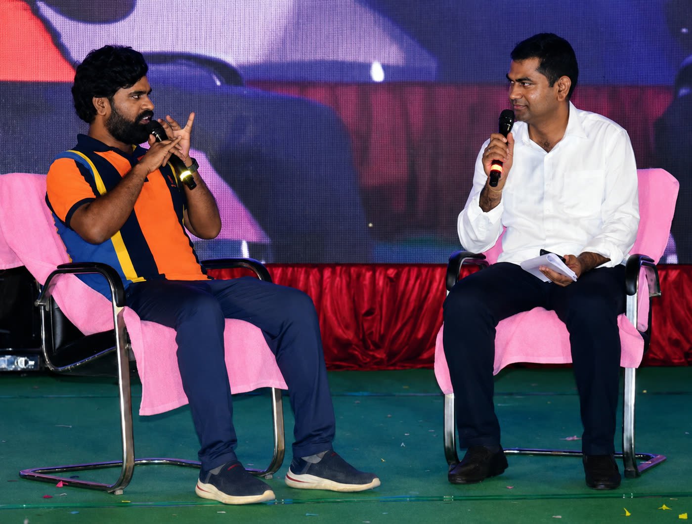 Fireside chat on stage at a Tejas academy event
